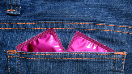 Condom in package in jeans. Men found condoms to prevent sexually transmitted infections or AIDS. Prevent HIV disease. Sexually transmitted disease.	