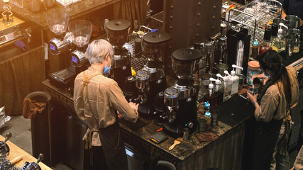 Bangkok, Thailand - November 9, 2021 : Coffee shop bar cafe Restaurant, Barista Prepare Coffee Working Order Concept.