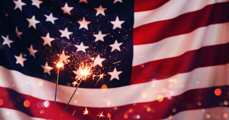 Sparklers  and american Flag. Independence day USA . Celebration 4th of July - Patriotic Holiday.