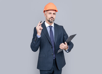 confident businessman hold folder. signing the contract. successful man in hardhat making notes.