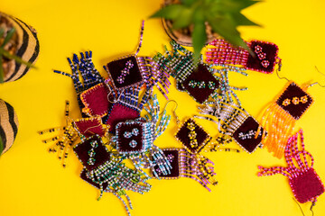 Earrings and crafts on a colorful background