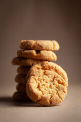 Close-up of stacking delicious freshly microwave oven baked simple cookies or biscuits.