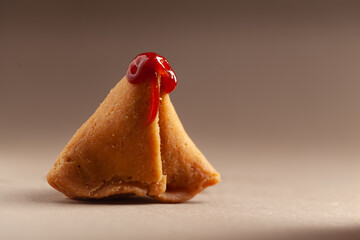 Close-up of freshly baked spicy and sweet samosa filled with dry fruits spicy dry chutney...