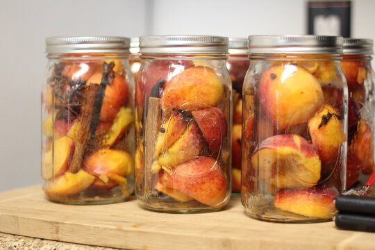 peaches and spices in canning jars
