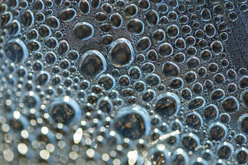 Bubbles at the bottom surface of the pan with boiling water