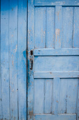 old blue wooden door, in a blue house