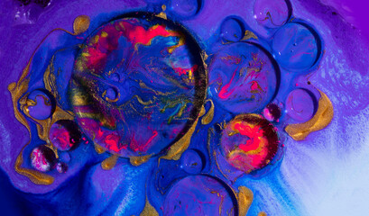 Oil bubbles on water abstract form in glass tank.