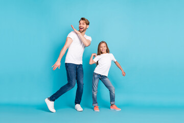 Full body photo of two carefree positive persons partying enjoy free time isolated on blue color background