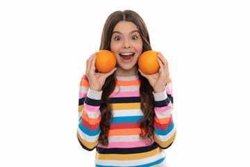 surprised kid in colorful sweater with orange fruit isolated on white, health