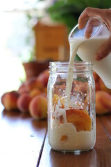 making a peach smoothie 