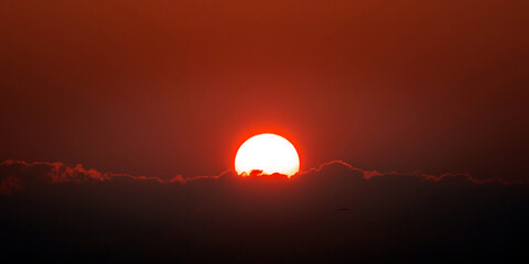 Sunset over the hills in clear weather gorizon clouds