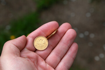 Vintage russian golden coin in hand