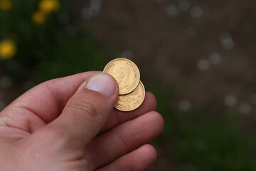 Two vintage Russian golden coins in hand
