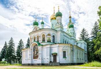 Fototapeta na wymiar Poltava city, Ukraine - June 29, 2019: Old Orthodox St. Sampson Church of the 19th century among the trees. Historical memorial in honor of the victory of the Russian Tsar Peter I over the swedish