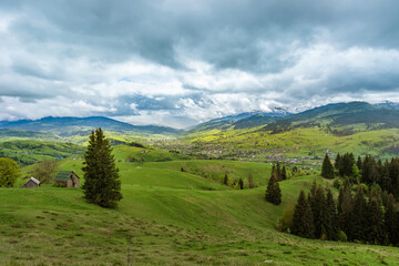 Fototapeta na wymiar amazing spring (summer) mountain landscape. blue dramatic cloudy sky. natural background