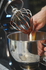 Sweet filling preparation process: melted chocolate in a metal bowl.