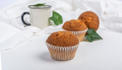 cupcakes and a white cup on a white background