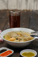 Indonesian food, mie ayam, noodles with chicken and served with meatballs