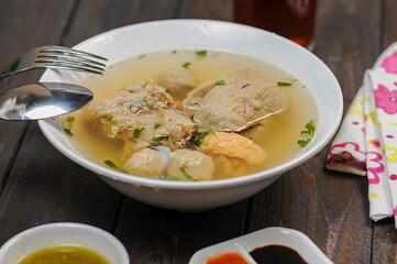 Indonesian food, mie ayam, noodles with chicken and served with meatballs