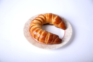 Fresh and tasty bagel with jam over white background