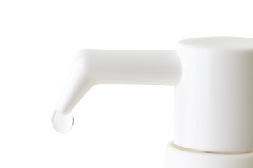 a drop of medicine from a dispenser on a white background
