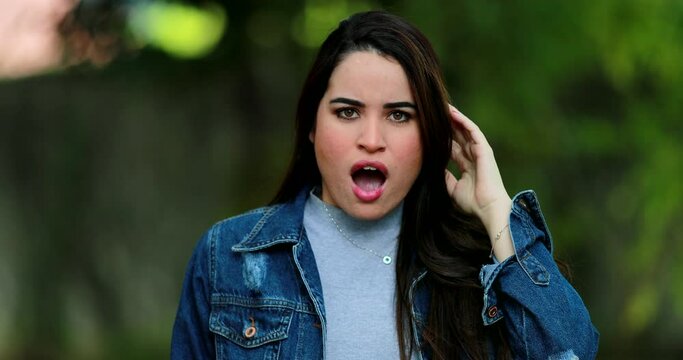 Young woman receiving bad news. Girl emotion reaction negative reaction