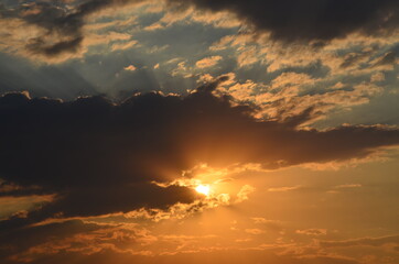 Golden beautiful sunset. Hands like heart. Copy space. Close up. Summer time. 