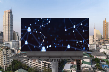 Glowing Social media icons on road billboard over panoramic city view of Bangkok, Southeast Asia. The concept of networking and establishing new connections between people and businesses.