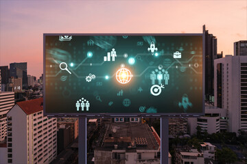 Research and technological development glowing icons on billboard. Night panoramic city view of...