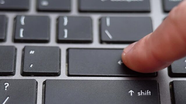 Enter button long pressing on keyboard, laptop keyboard close up