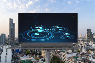 Glowing hologram of technological process on billboard, aerial panoramic cityscape of Bangkok at...