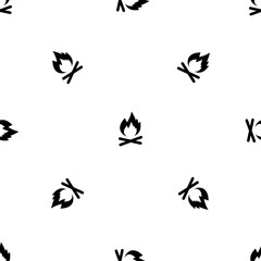 Seamless pattern of repeated black bonfire symbols. Elements are evenly spaced and some are rotated. Vector illustration on white background