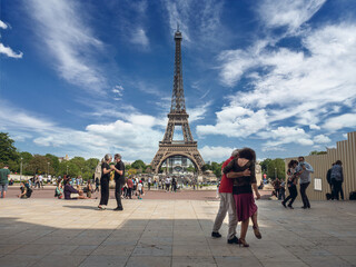 Fototapeta na wymiar Paris, France, May 2021. Dancing Argentine couples tango on the Tracadero square in the background the Eiffel Tower symbol of Paris, the city of love