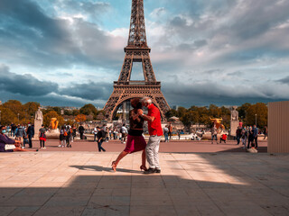 Paris, France, May 2021. Dancing Argentine couples tango on the Tracadero square in the background...