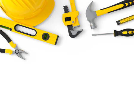 Top view of yellow construction tools for repair and installation on white