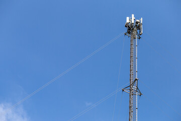 transmitter atop a cell phone pole About to be upgraded from 4g to 5g. High-risk electrical...