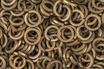 Brass color steel grover washers for industrial manufacturing. Texture background of grover washers.