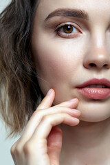 Beautiful young woman closeup portrait with natural nude makeup.
