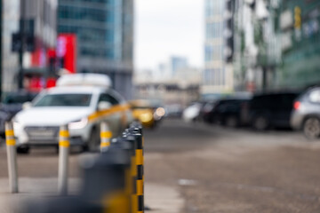 parking bollards on the street of the metropolis. black and yellow car barriers