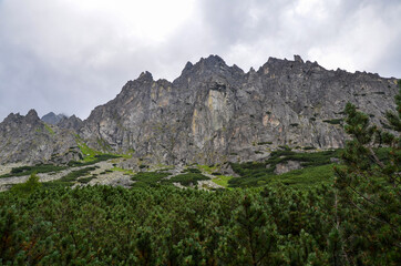 Scenic view of sharp rocky mountains covered with clouds in High Tatras, Slovakia 