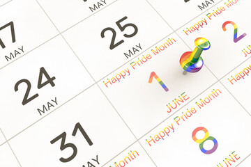 3d rendering of important days concept. June 1st is the start of pride month on calendar. Human rights and tolerance. LGBTQ+ flag. Rainbow colored date written and pinned on a calendar.