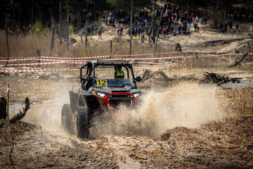 Offroad vehicle in the action and makes splashes of dirty water © Antonio