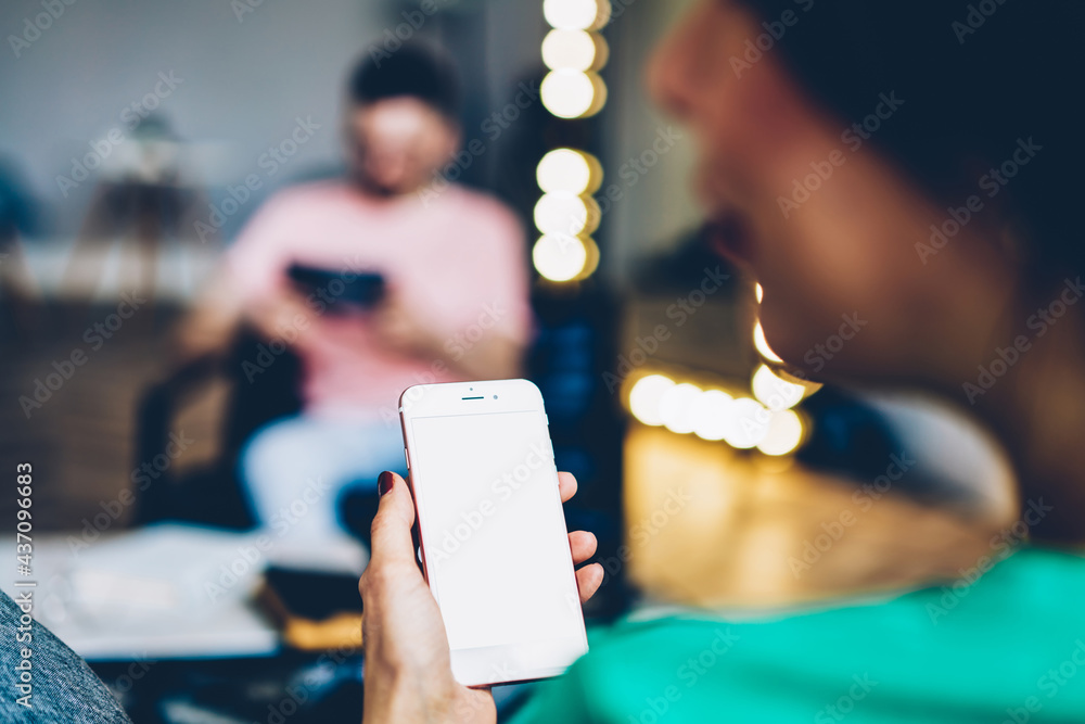 Poster unrecognizable female blogger using home internet connection on mockup smartphone technology with co