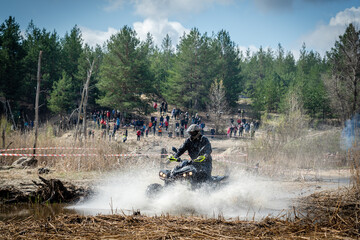 Atv rider in muddy water. Xtreme utv ride