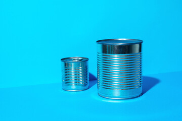 Tin can with food on blue background