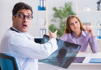Doctor examining x-ray images of patient