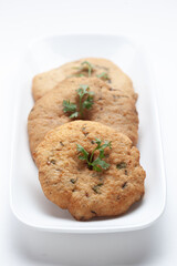 Plain dry dahi badhe for preparation of chaat, Garnished with cumin and green fresh coriander