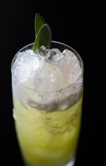 long glass drink with garnish close up