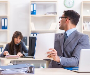 Man and woman working in the office