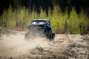 Summer UTV, ATV & offroad driving in dust. Quad racing © Antonio